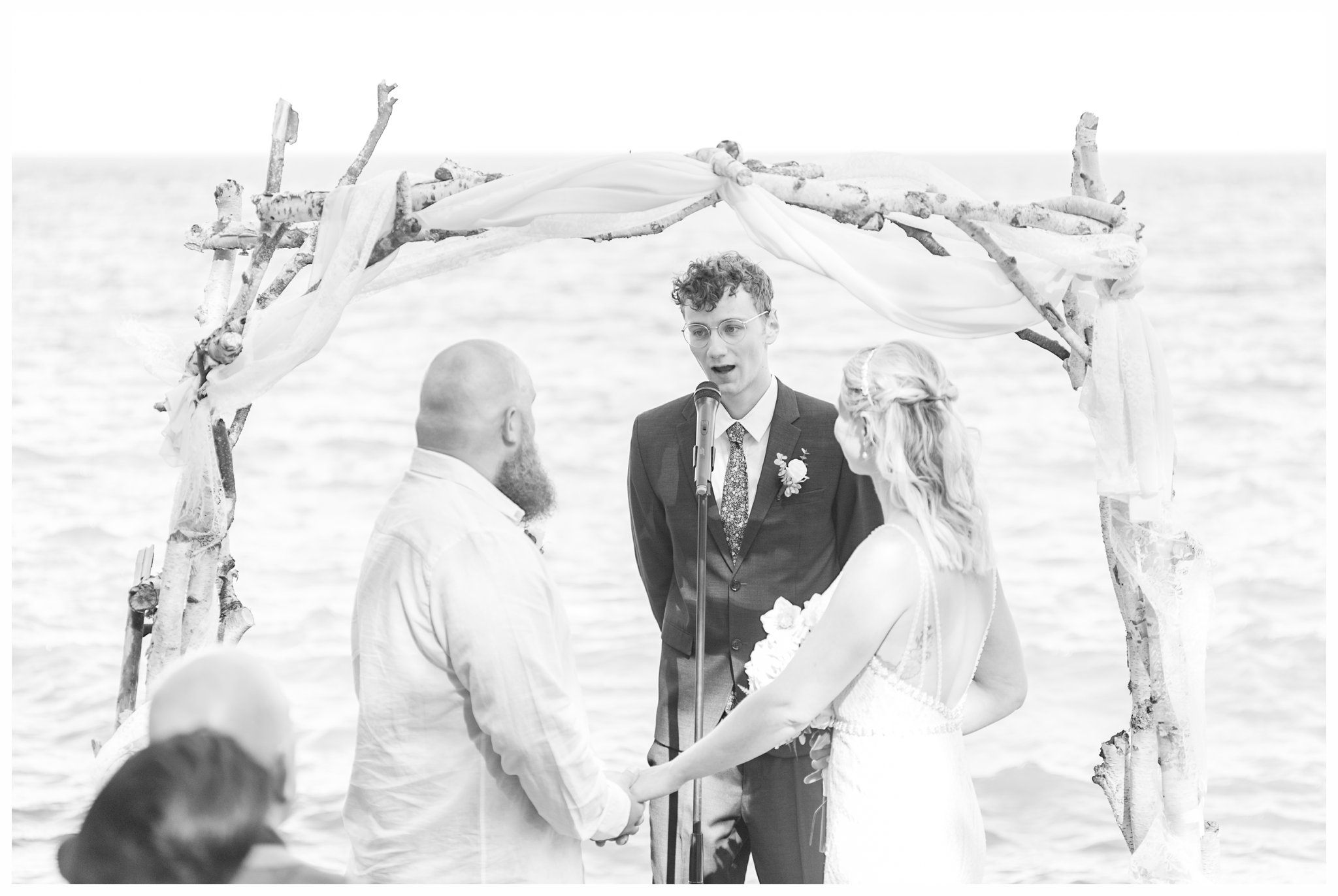 Ceremony at a summer Bluefin Bay Wedding. Photo by Kayla Lee.
