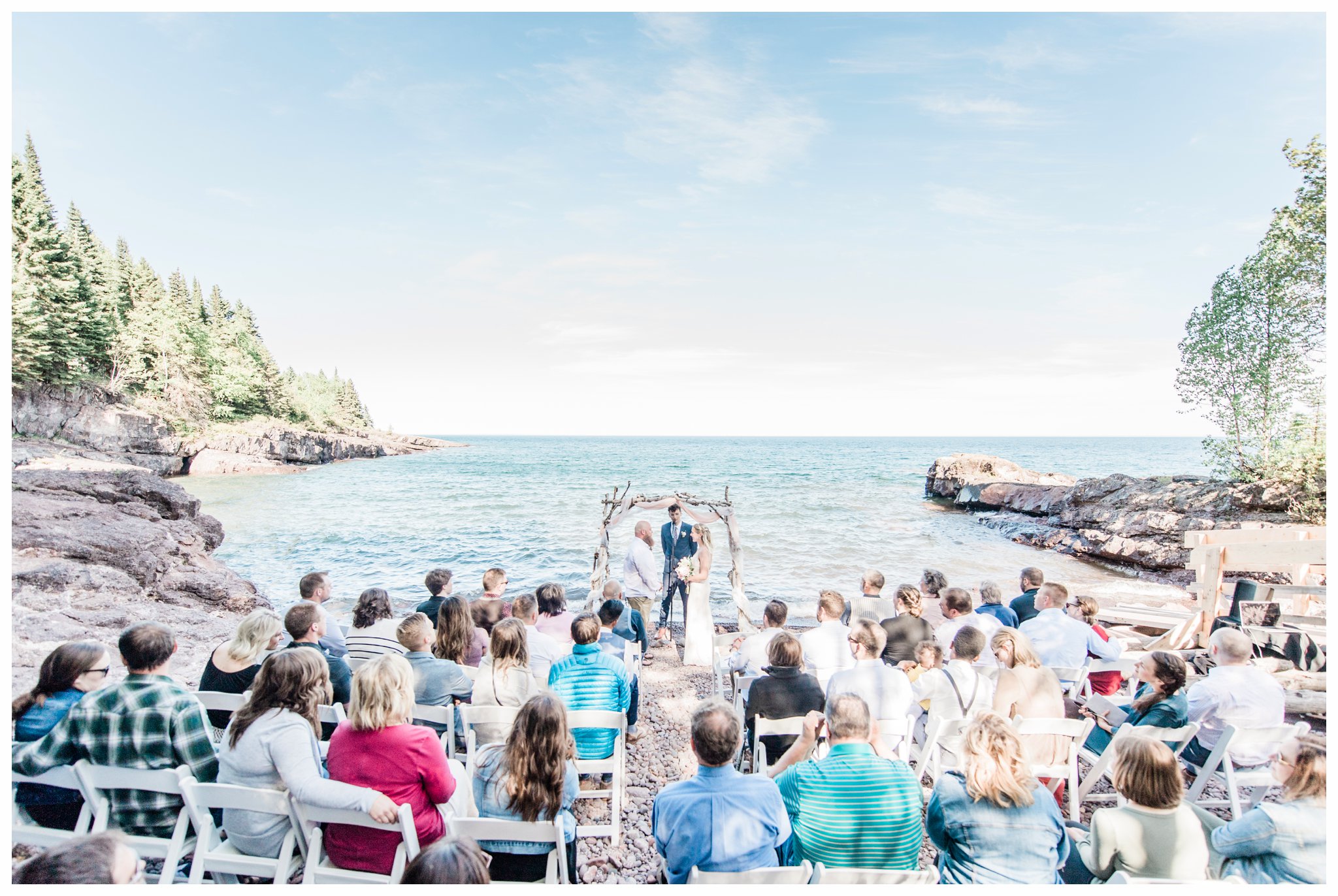 Ceremony at a summer Bluefin Bay Wedding. Photo by Kayla Lee.