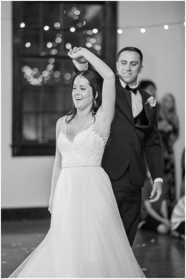 Bride and groom celebrate first dance at a Minneapolis golf course wedding. Photo by Kayla Lee.