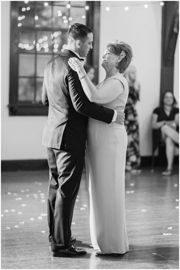 Groom and mom dance at a Minneapolis golf course wedding. Photo by Kayla Lee.