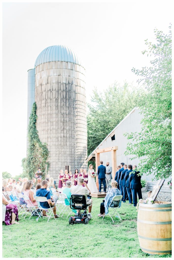 Ivy covered silos. What a ceremony backdrop! Painted Prairie Vineyard. Photo by Kayla Lee Photography.