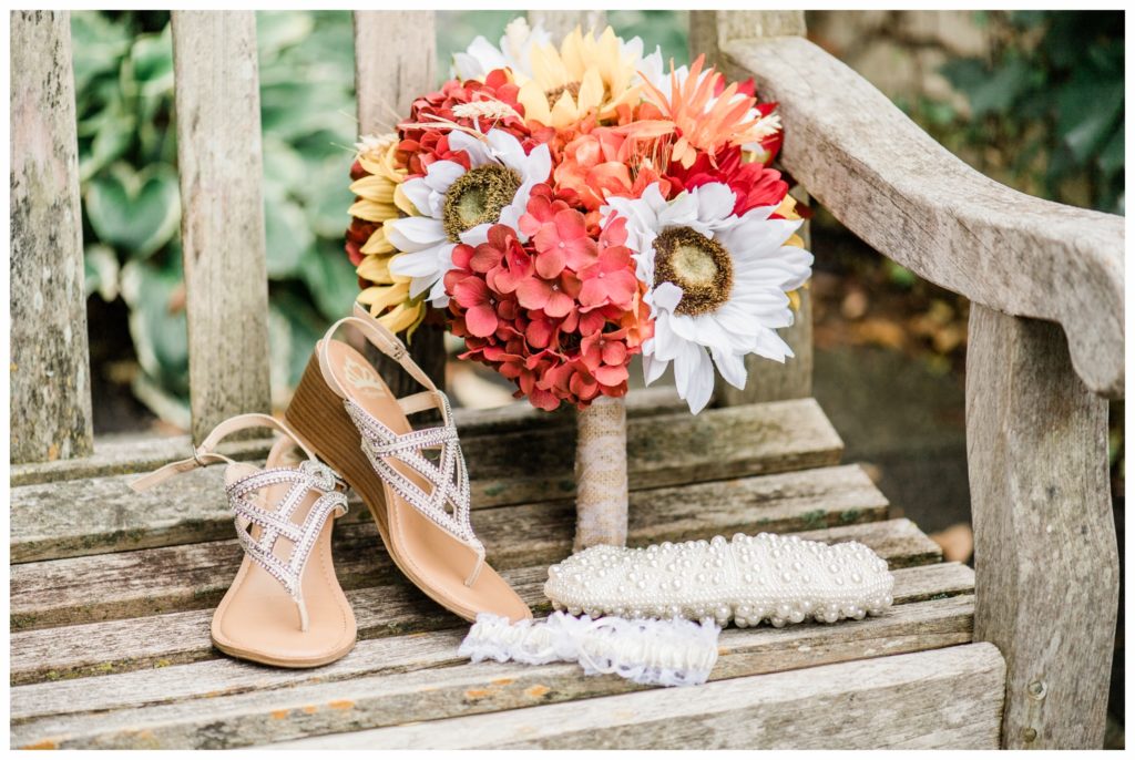 A maroon and gold fall wedding at the Minnesota Landscape Arboretum. Photography by Kayla Lee.