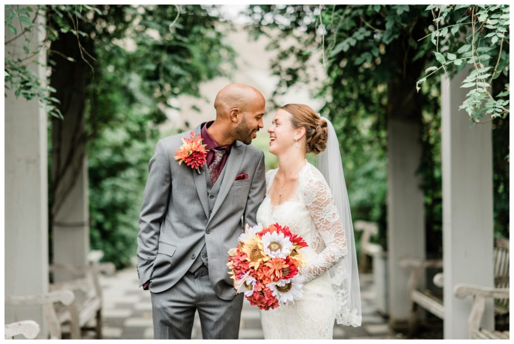 A maroon and gold fall wedding at the Minnesota Landscape Arboretum. Photography by Kayla Lee.