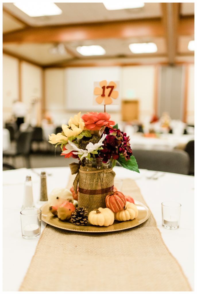 Fall centerpieces for this maroon and gold fall wedding at the Minnesota Landscape Arboretum. Photography by Kayla Lee.