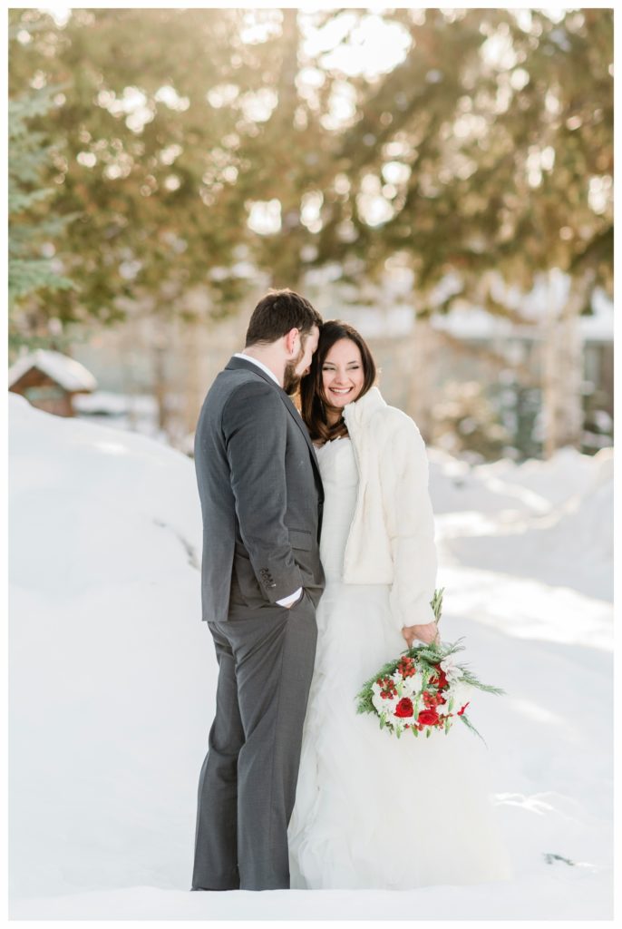 A red and green Christmas-inspired winter elopement at Gunflint Lodge. Photography by Kayla Lee.