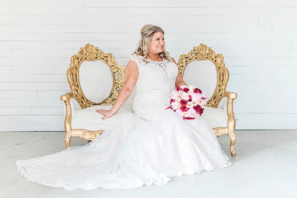 Want an iconic bridal portrait like this, consider renting vintage furniture for your wedding! Seating from The White House Co., photo by Kayla Lee.