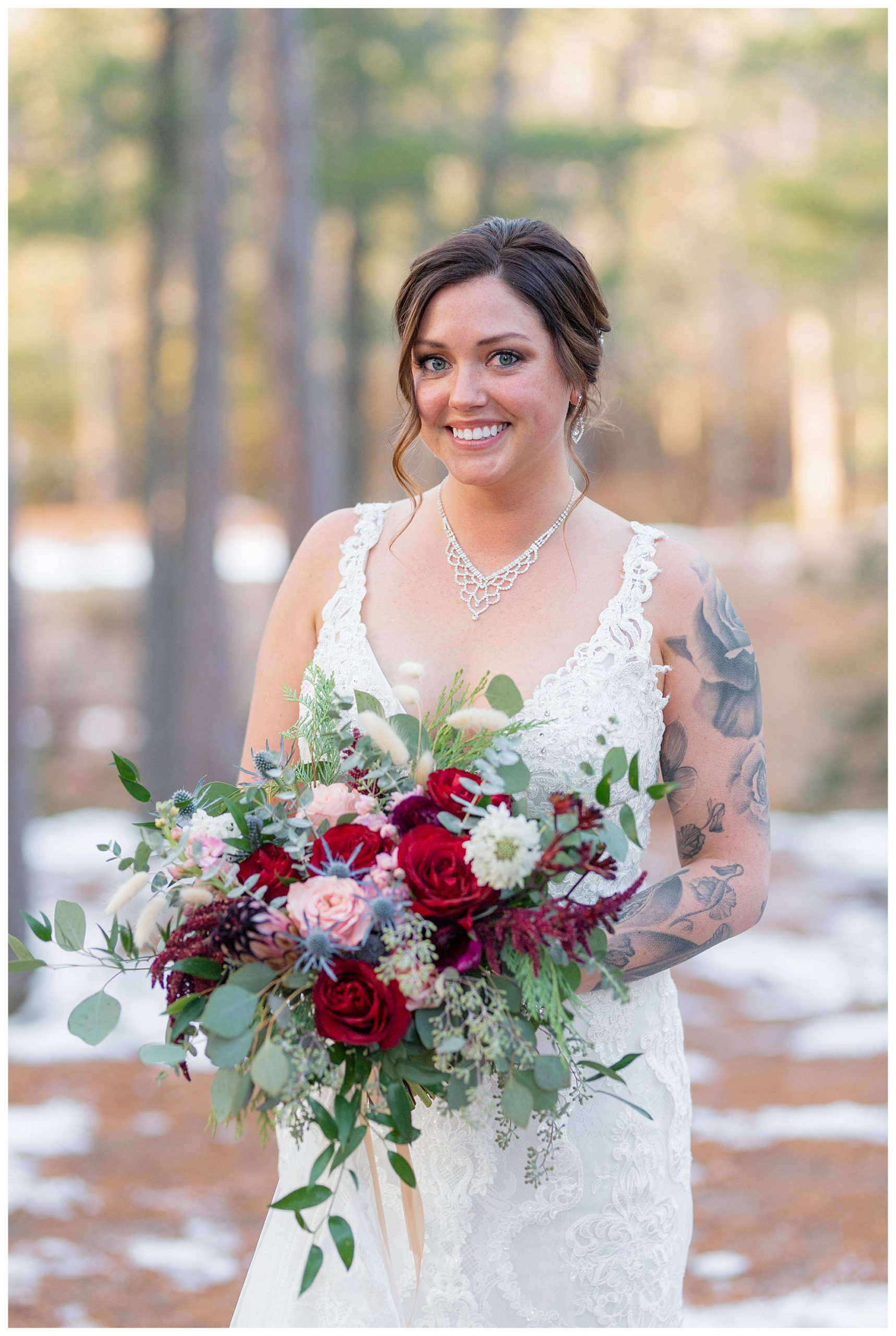 Beautiful bride at a navy and maroon/burgundy state park fall elopement. Photo by Kayla Lee.