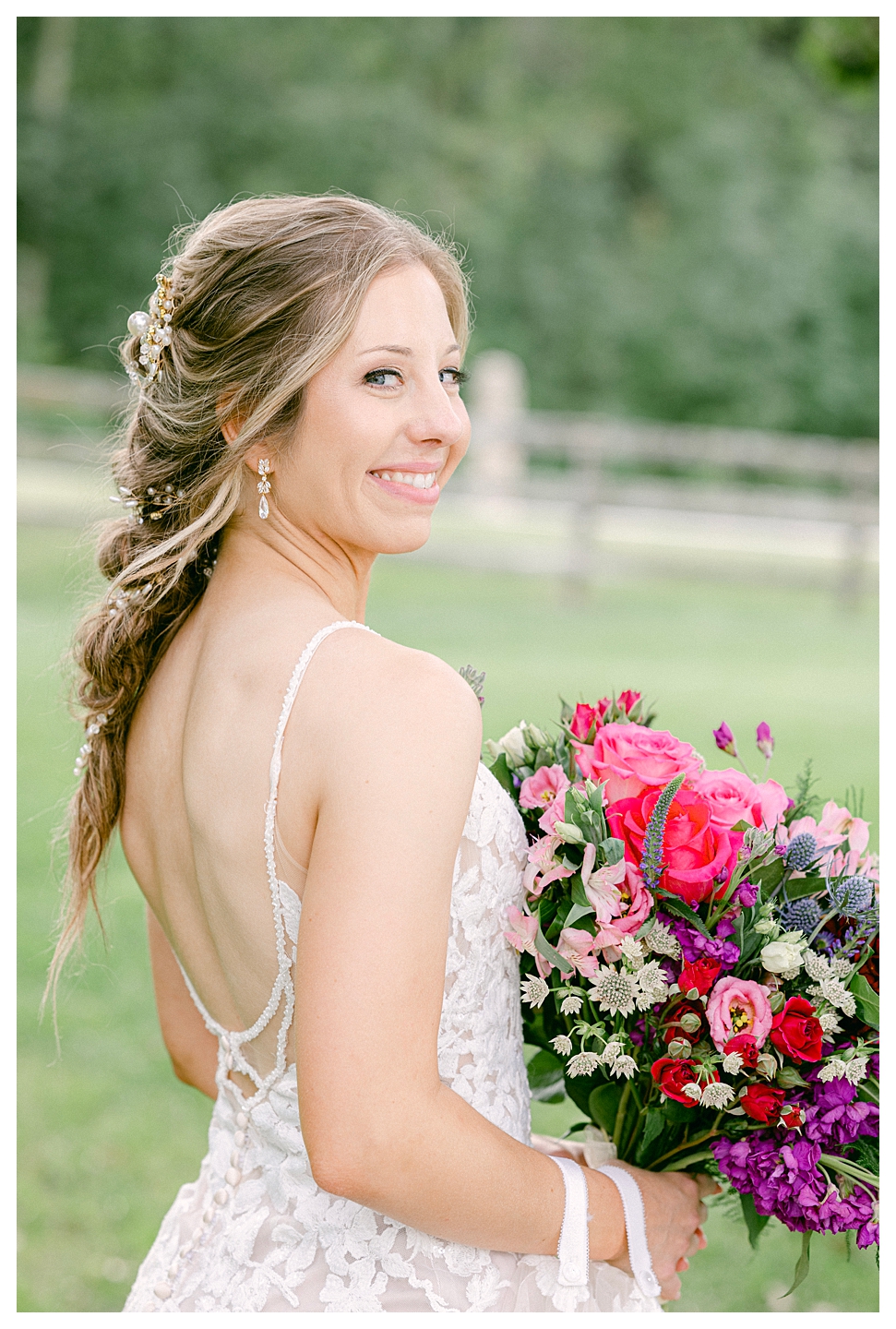 The bride with her flowers at a Mayowood Stone Barn Wedding. Photo by Kayla Lee.