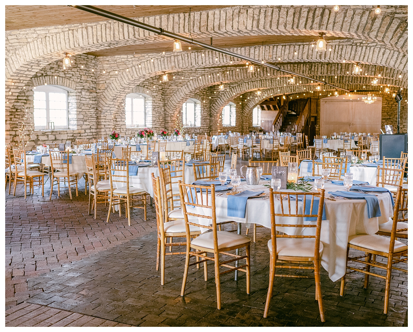 The decorated reception space a Mayowood Stone Barn Wedding. Photo by Kayla Lee.