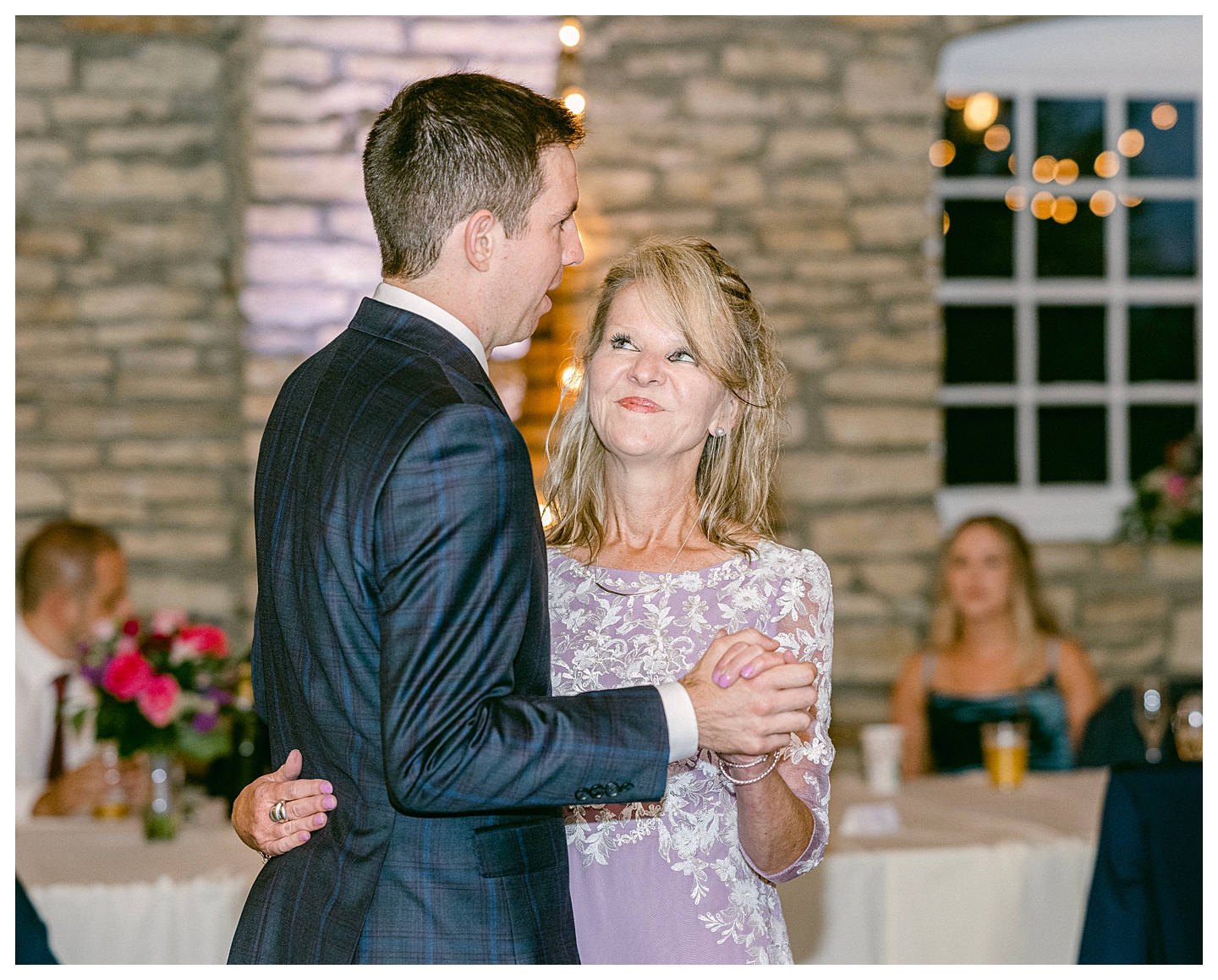 The groom dances with his mom at a Mayowood Stone Barn Wedding. Photo by Kayla Lee.