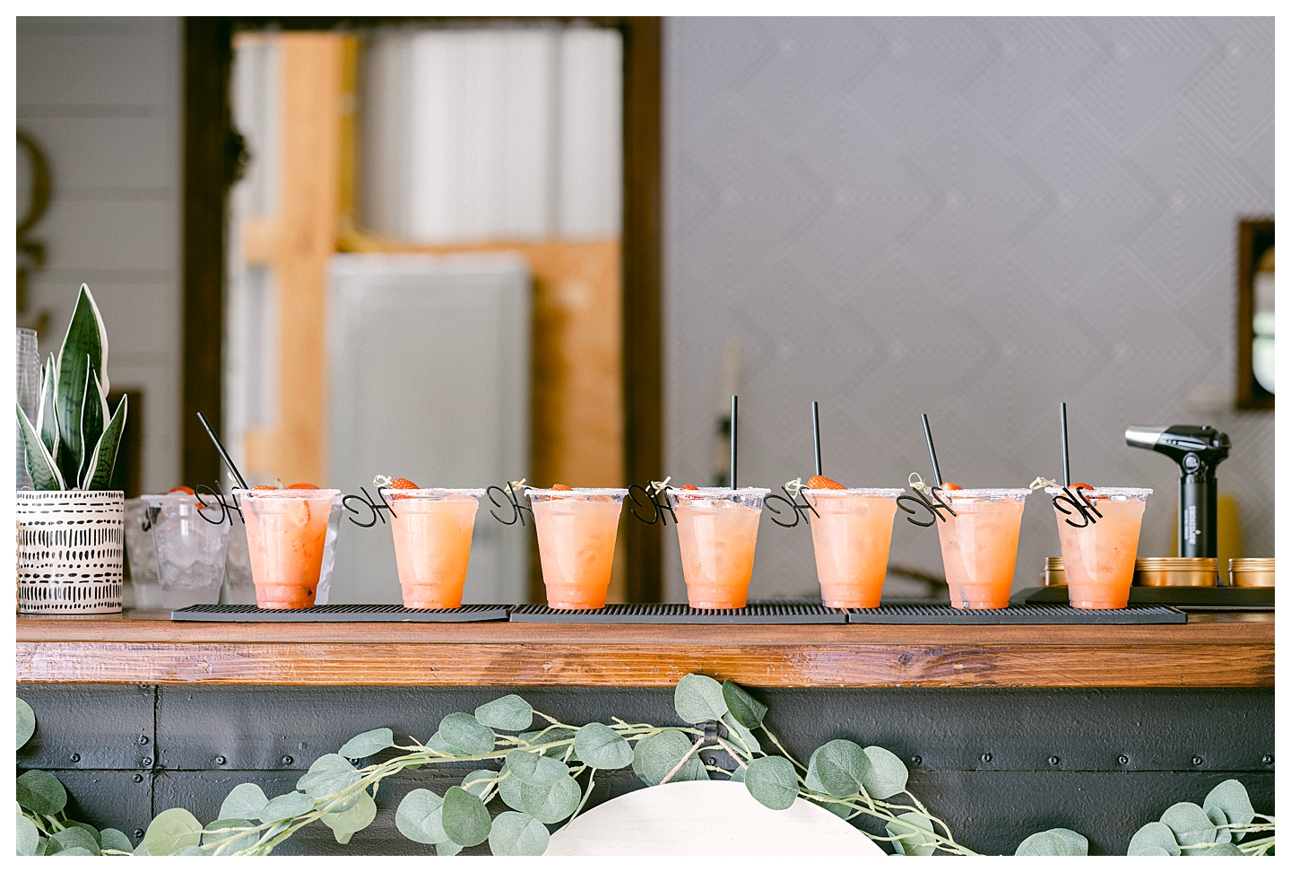 A row of pink margaritas in a row on the ledge of Sip and Savor Mobile Bar. Photo by Kayla Lee.